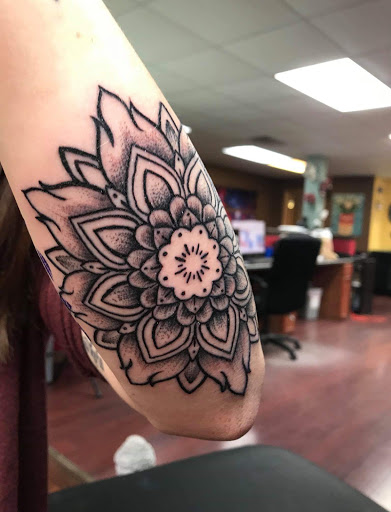 Explore face tattoo ideas, creative tattoo ideas in Loveland, available at Satori Tattoo