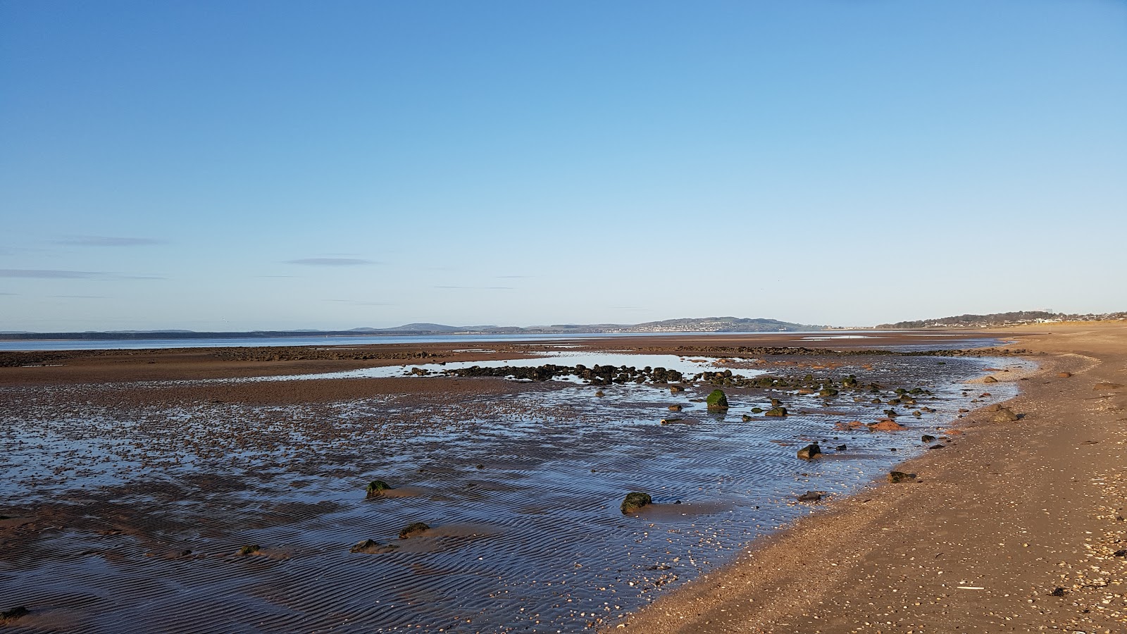 Photo of Angus Beach with bright sand surface