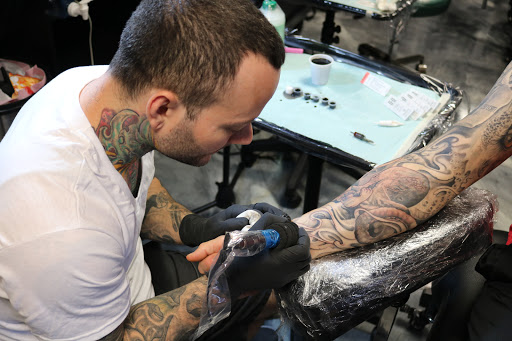 Explore black rose tattoo cover up ideas, creative tattoo ideas in Edgewood, available at Evolved Body Arts