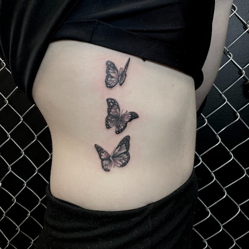 Explore weightlifting tattoo ideas, creative tattoo ideas in Buffalo, available at True Gloom Tattoo Studio