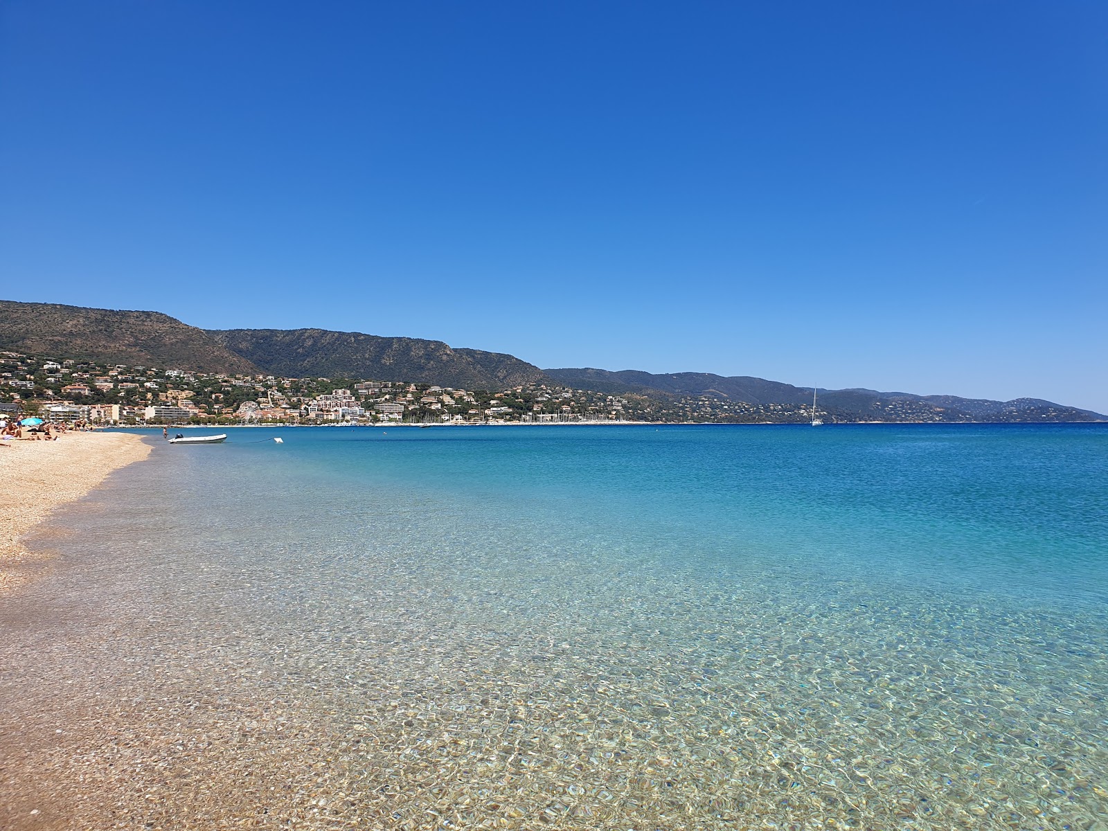 Photo of Lavandou Beach with turquoise pure water surface