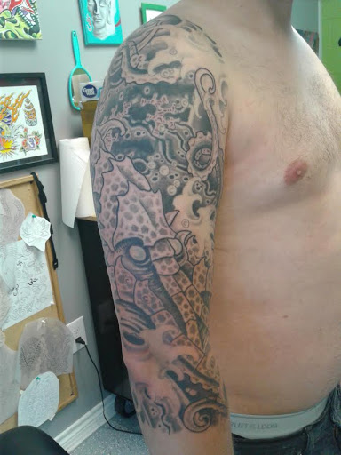 Find tattoo ideas for upper arm men for your next unique tattoo in League City at Zen Body Art & Adornment Tattoo Shop