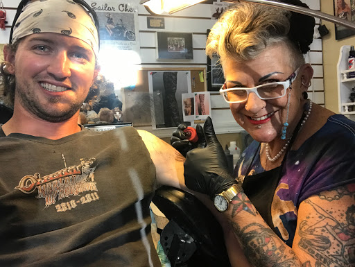 Explore love is pain tattoo ideas, creative tattoo ideas in Saint Augustine, available at Sailor Chers Tattoo & Body Piercing