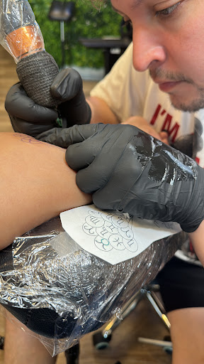 Explore cross tattoo ideas for women, creative tattoo ideas in Davenport, available at Fine Ink Studios Tattoos