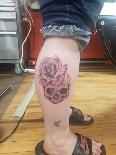 Explore feminine neck tattoo ideas, creative tattoo ideas in Galesburg, available at Hawks Tattoos