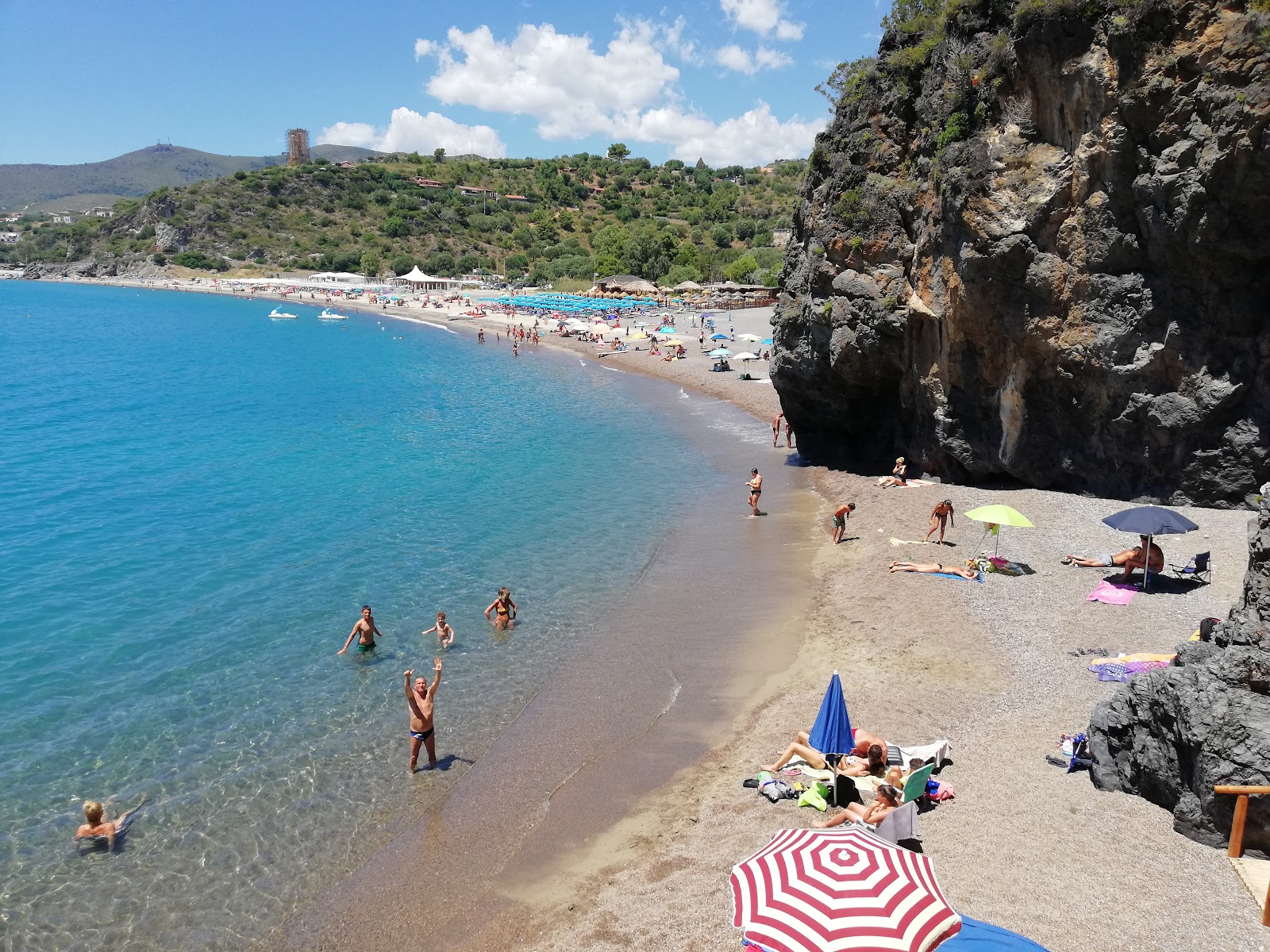 Fotografija Spiaggia Lentiscelle z rjavi fini kamenček površino
