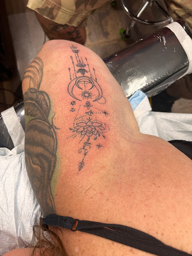 Explore purple flower tattoo ideas, creative tattoo ideas in Saint Paul, available at No Joke Tattoo Studios