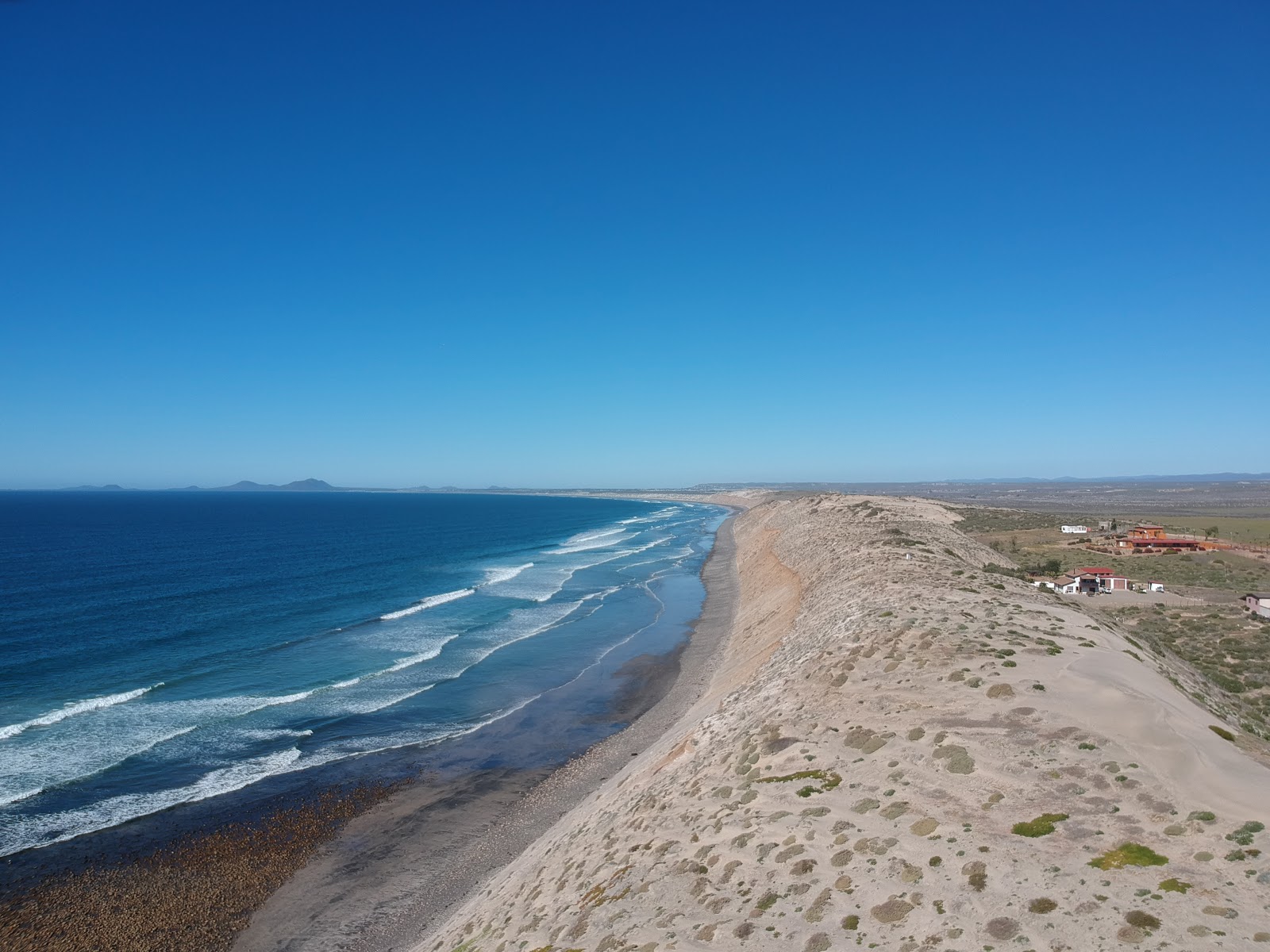 Playa El Socorrito'in fotoğrafı geniş plaj ile birlikte
