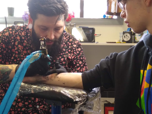 Explore mens tricep tattoo ideas, creative tattoo ideas in Sioux City, available at Addictive Tattoo-Piercing