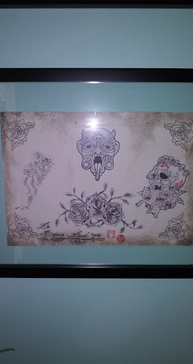 Explore candle tattoo ideas, creative tattoo ideas in Houston, available at The Neon Jackal Tattoo