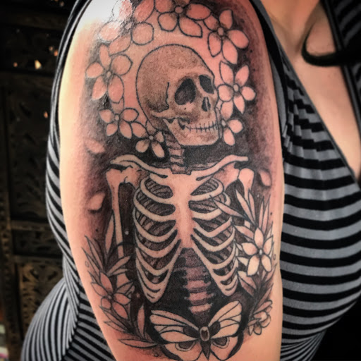 Explore banksy tattoo ideas, creative tattoo ideas in Tecumseh, available at Lucid Tattoo Gallery