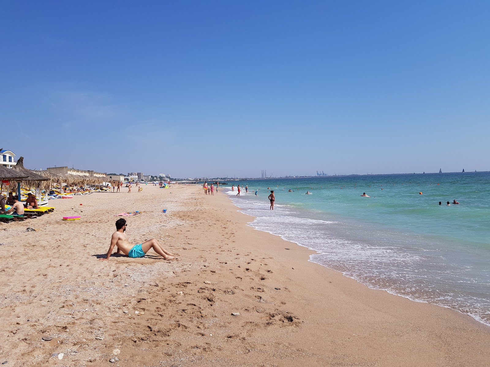 Fotografija Boeme beach z svetel pesek površino
