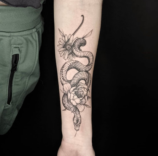 Explore tattoo ideas on the thigh, creative tattoo ideas in Charlotte, available at Canvas Tattoo & Art Gallery