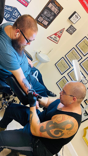 Explore bass tattoo ideas, creative tattoo ideas in Orlando, available at Alejandro Tattoo & Body Piercing - Orlando