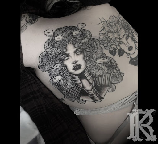 Explore ribbon tattoo ideas, creative tattoo ideas in Modesto, available at Dying Art Tattoo