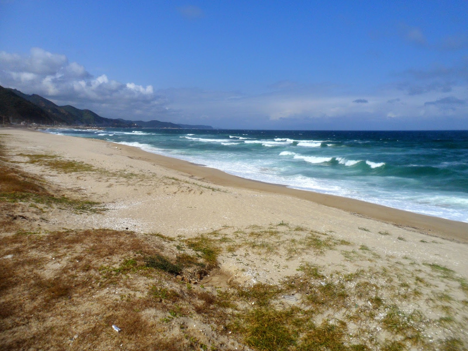 Fotografija Mangyang Beach in naselje