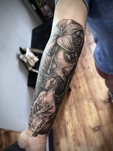 Explore arm tattoo men ideas, creative tattoo ideas in Fort Oglethorpe, available at The Helm Tattoo & Piercing