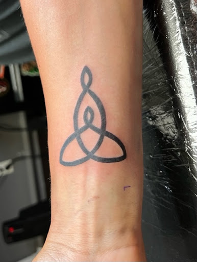 Find women's rib tattoo ideas for your next unique tattoo in Tipton at Secret Place Tattoo Studio
