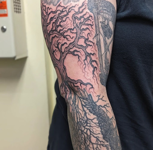 Explore back of the ear tattoo ideas, creative tattoo ideas in Athens, available at Pain and Wonder Tattoo and Piercing Studio