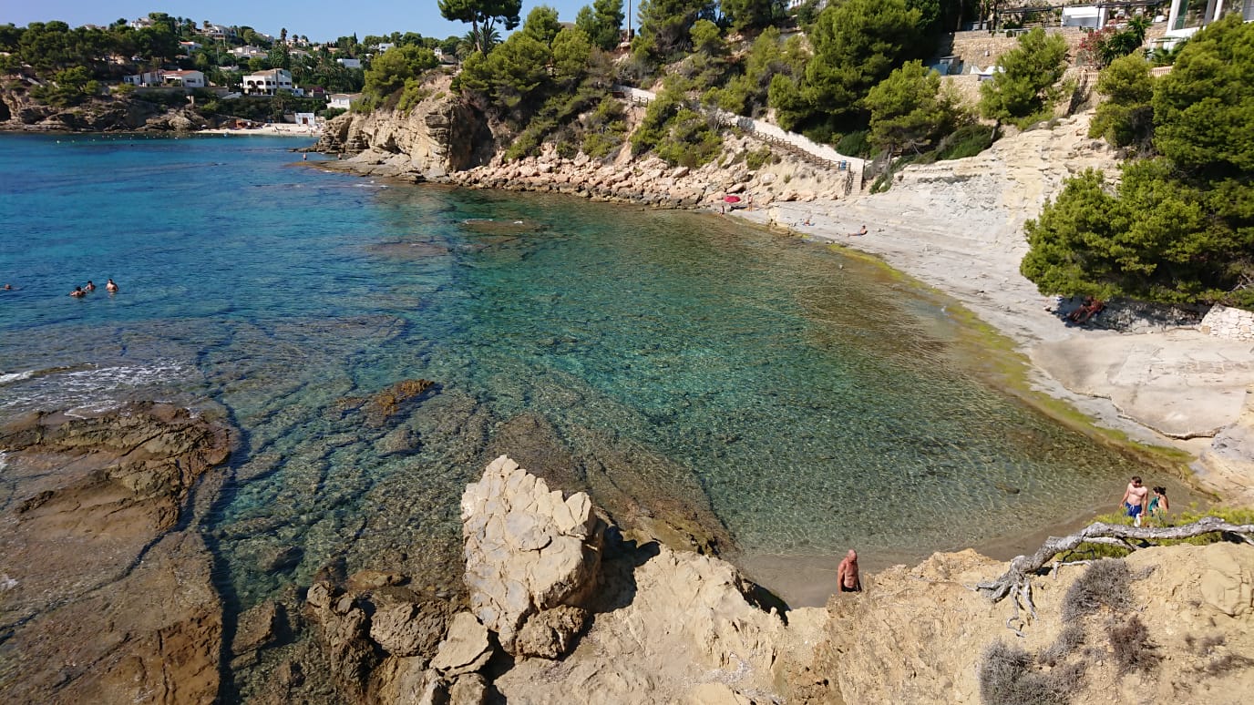 Photo of Cala Pinets with blue pure water surface