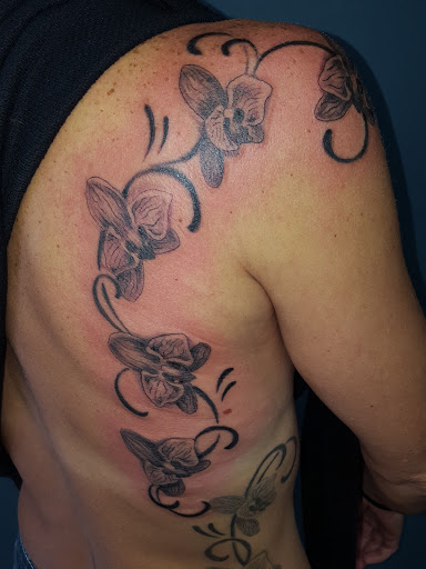 Explore mens tricep tattoo ideas, creative tattoo ideas in Oak Forest, available at Peace Of Art Tattoo And Art Studio