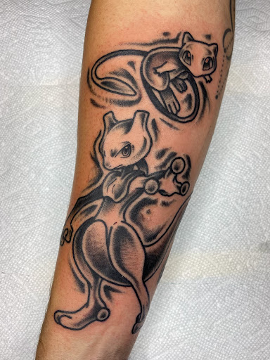 Explore tattoo ideas for men lower arm, creative tattoo ideas in Milford, available at Golden Hammer Tattoo Studios