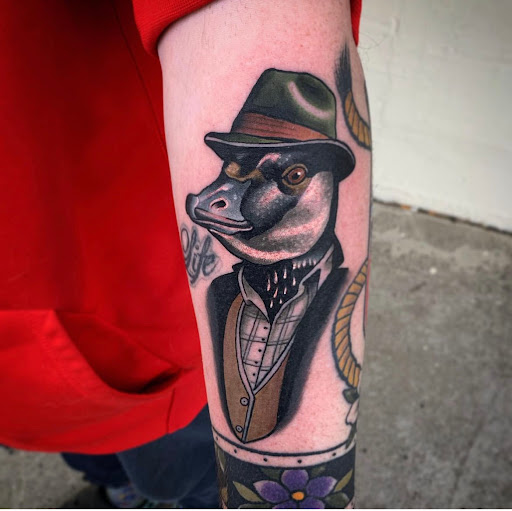 Explore neck tattoo idea, creative tattoo ideas in Chaffee, available at Old Gold Tattoo
