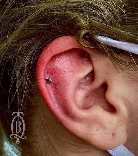 Explore women's thigh tattoo ideas, creative tattoo ideas in Marietta, available at The Queen Bee Tattoo and Piercing Parlour