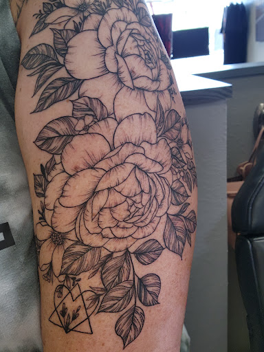 Explore forearm tattoo filler ideas, creative tattoo ideas in Winter Park, available at Fine Ink Studios Tattoos