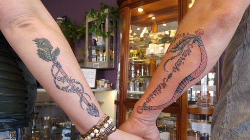 Explore female arm tattoo ideas, creative tattoo ideas in Redding, available at The Salty Sloth Tattoo