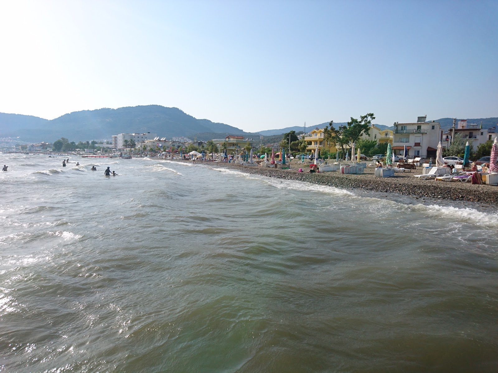 Foto von Yakamoz Cafe beach mit türkisfarbenes wasser Oberfläche