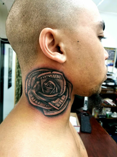 Explore green arrow tattoo ideas, creative tattoo ideas in Phenix City, available at Skin Traditions Tattoo Studio