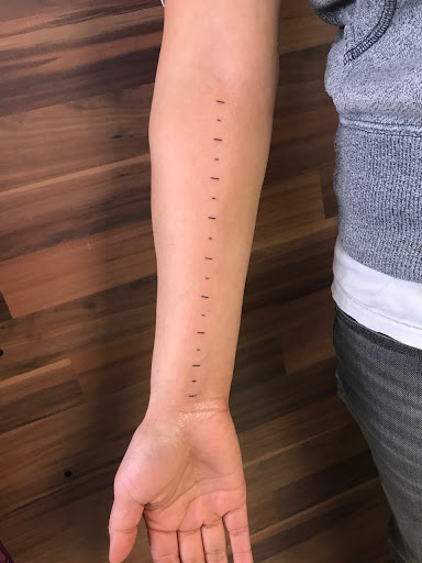 Explore small dog tattoos ideas, creative tattoo ideas in Milwaukee, available at Bay Street Tattoo Co.