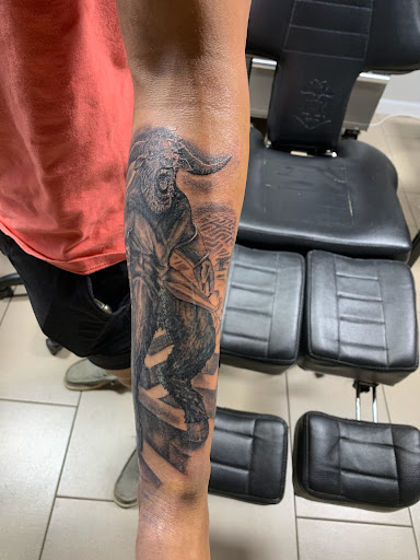 Explore tattoo for son ideas, creative tattoo ideas in Sarasota, available at SEVEN SINS Tattoo Studio