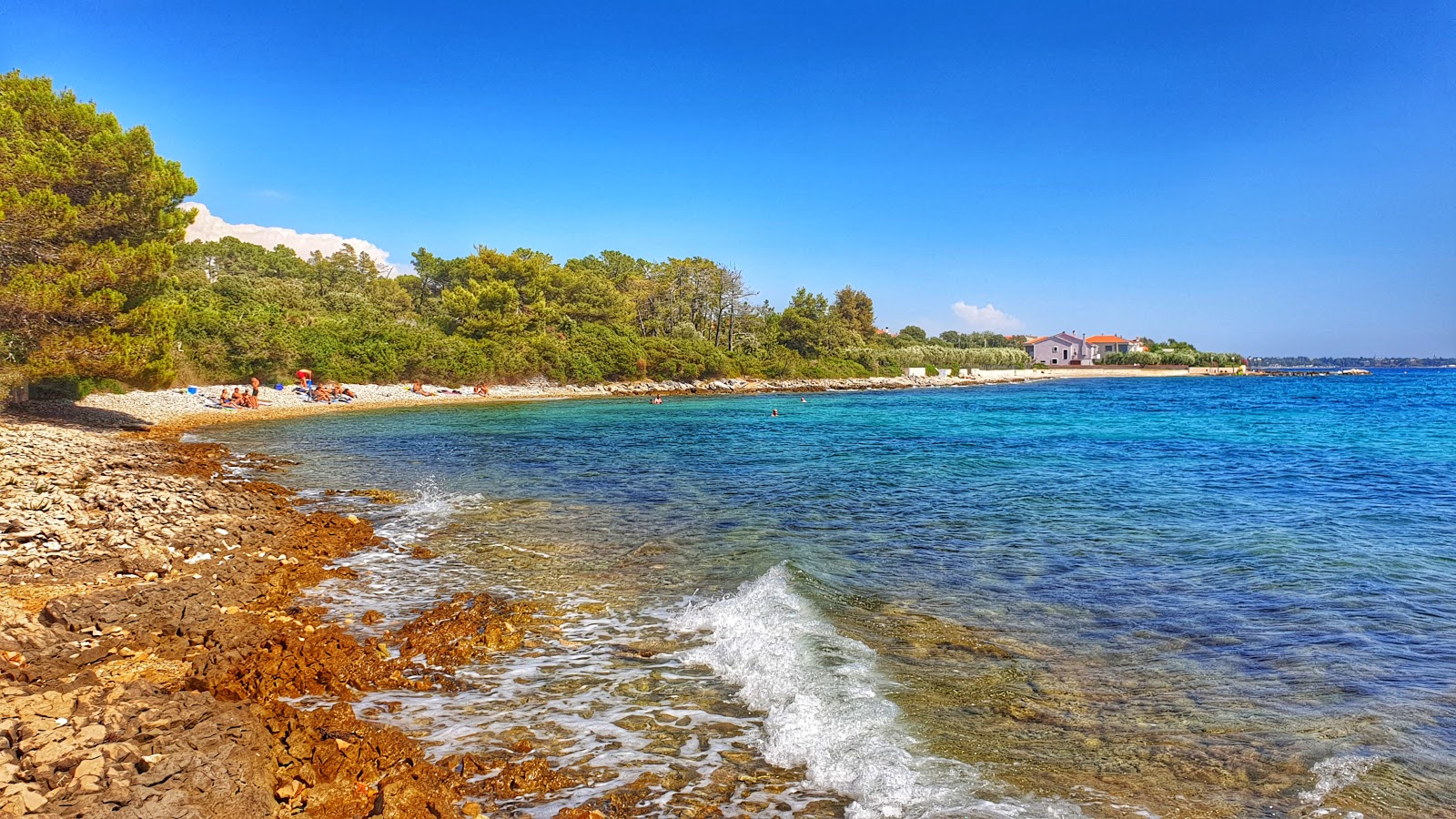 Photo of Kozino beach with rocks cover surface