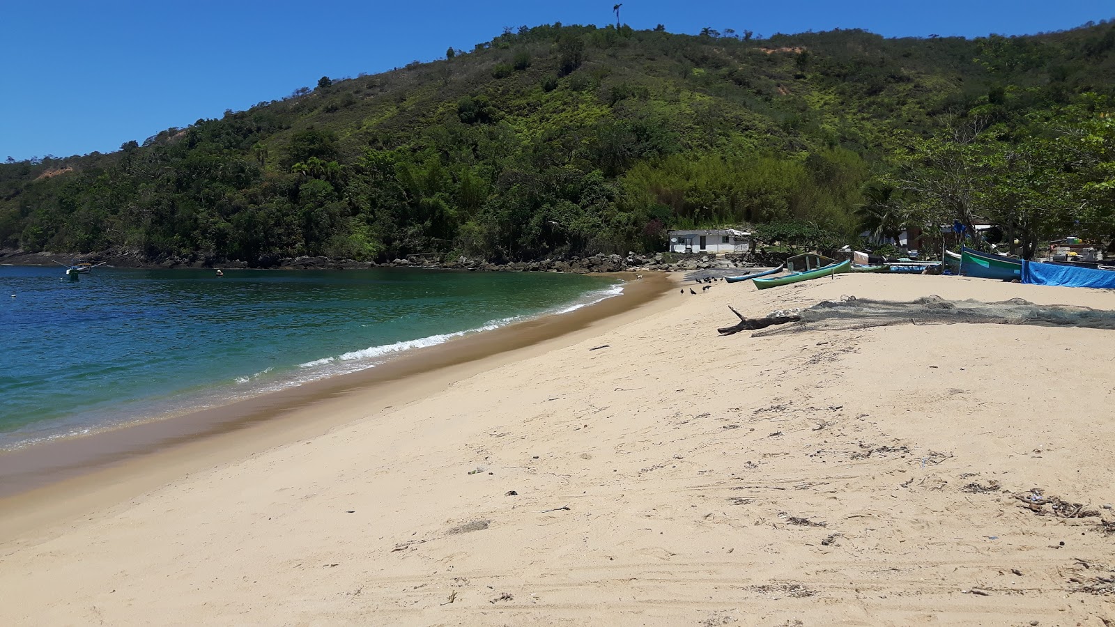 Foto di Praia da Serraria con una superficie del sabbia beige