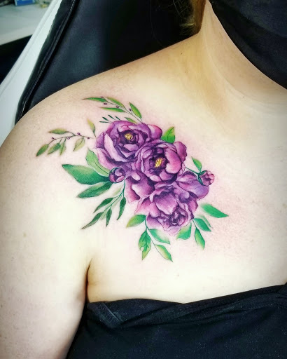 Explore blessed neck tattoo ideas, creative tattoo ideas in Benton, available at Spectrum Tattoo