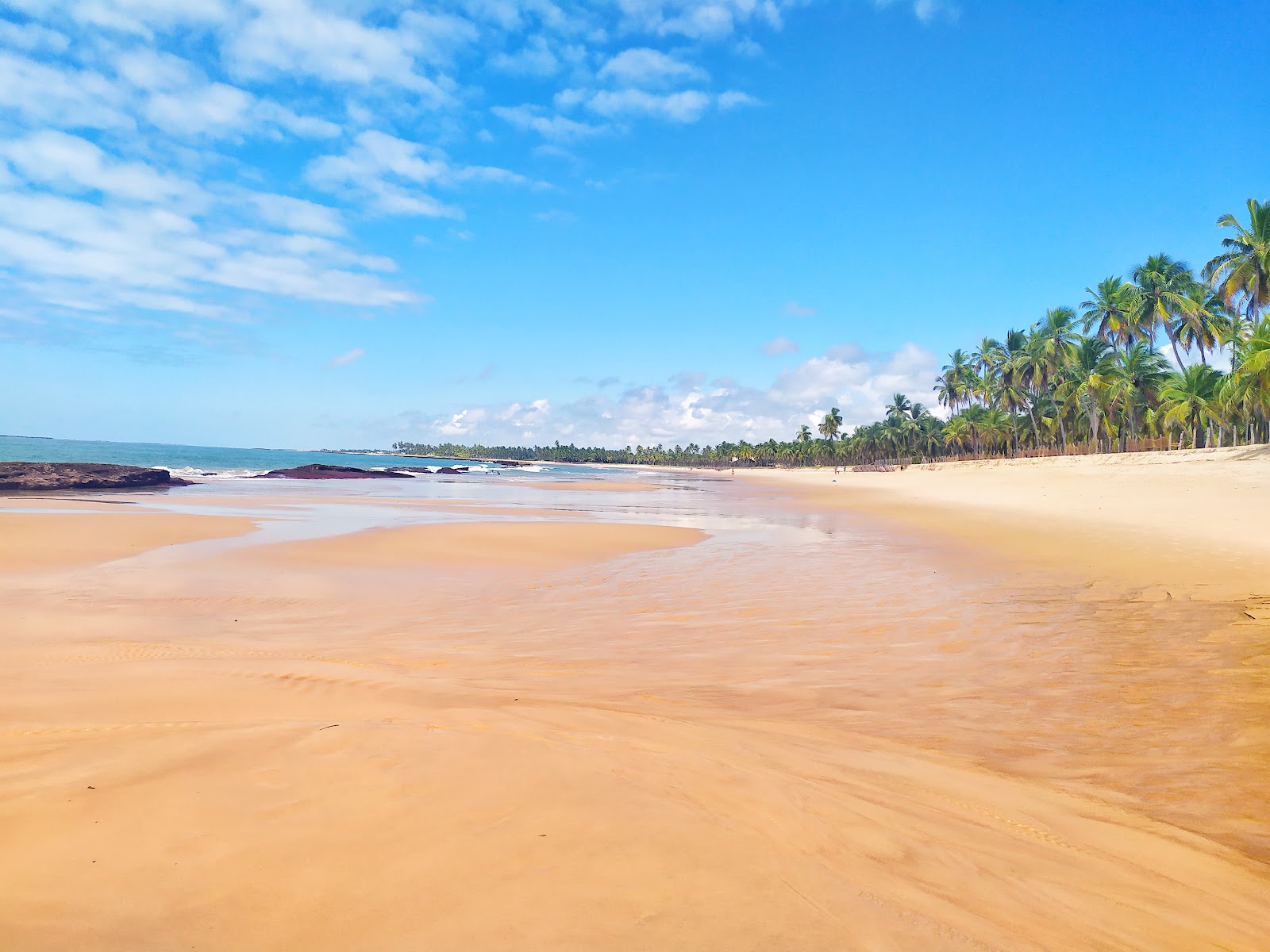 Foto av Praia de Toquinho med lång rak strand