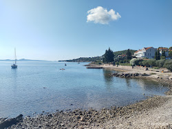 Dolinje Beach'in fotoğrafı düz bir kıyı şeridi ile birlikte