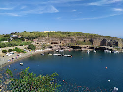 Cala Rossano Beach'in fotoğrafı düz bir kıyı şeridi ile birlikte