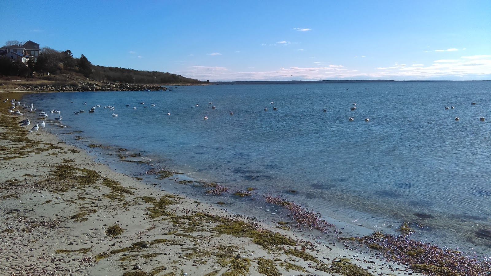 Valokuva Little Harbor Beachista. pinnalla turkoosi vesi:n kanssa