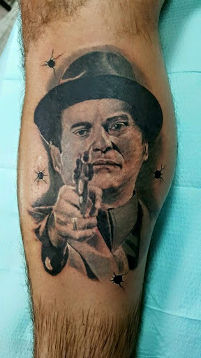 Explore black couple tattoo ideas, creative tattoo ideas in Sarasota, available at SEVEN SINS Tattoo Studio