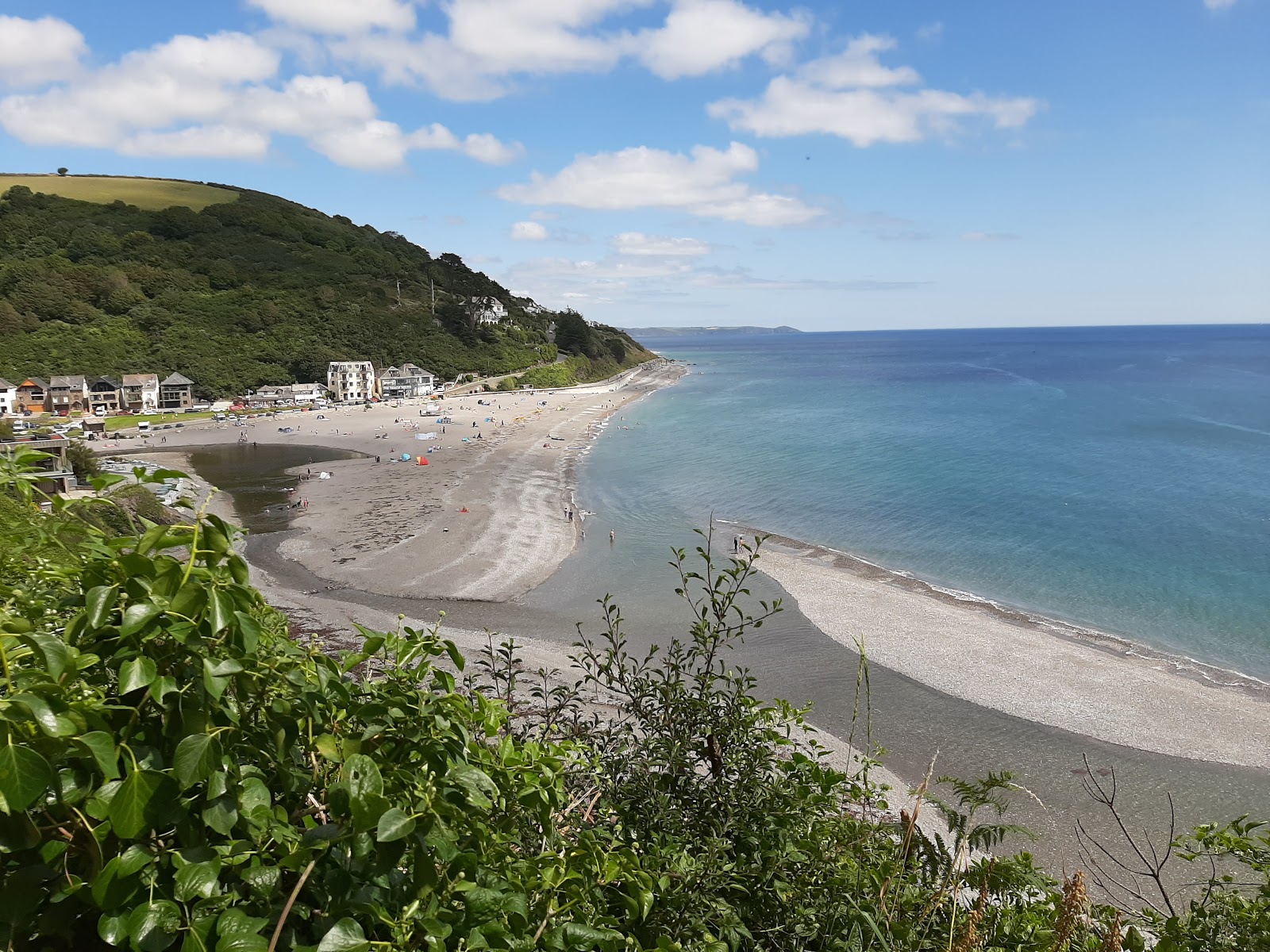 Photo of Seaton beach with turquoise water surface
