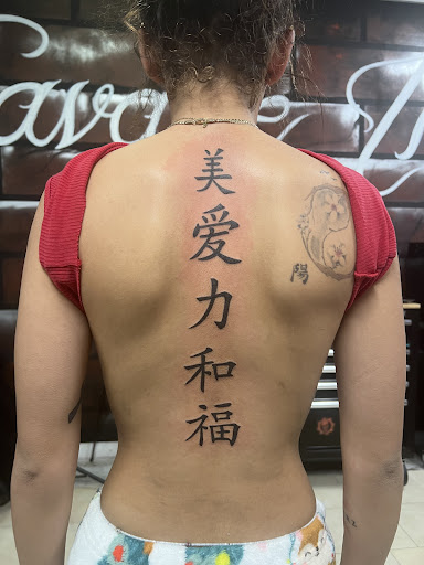 Find small tramp stamp tattoo ideas for your next unique tattoo in Lakeville at Savage Ink
