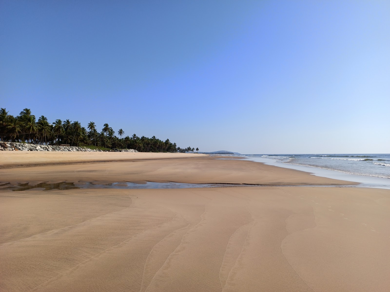 Photo de Pavinkurva Beach avec sable lumineux de surface