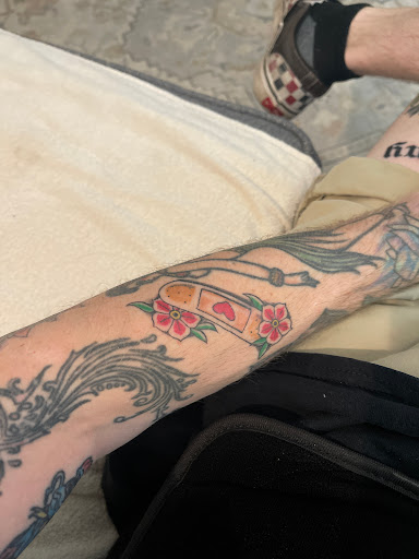 Explore cover up tattoo ideas for men, creative tattoo ideas in Stuart, available at Tiger Shark Tattoo Studio