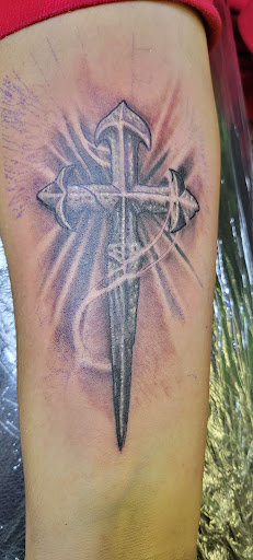 Explore cross tattoo ideas small, creative tattoo ideas in Angola, available at Hoodlum Ink