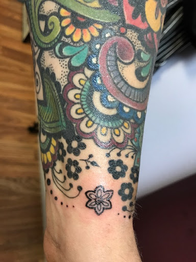 Explore climbing tattoo ideas, creative tattoo ideas in Olympia, available at Primeval Ink Tattoo