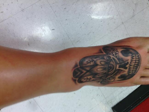 Explore flower finger tattoo ideas, creative tattoo ideas in El Paso, available at Pumping Ink Tattoo Parlor