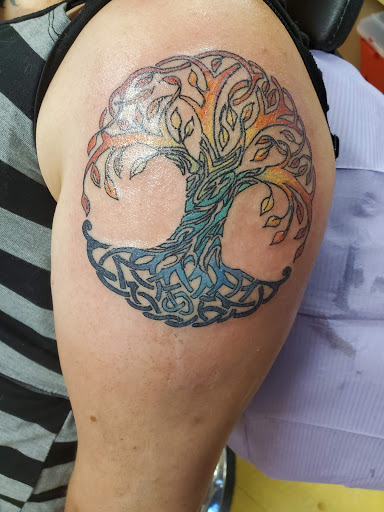 Find tattoo sunflower ideas for your next unique tattoo in Mandan at NarDawahls Tattoo Emporium